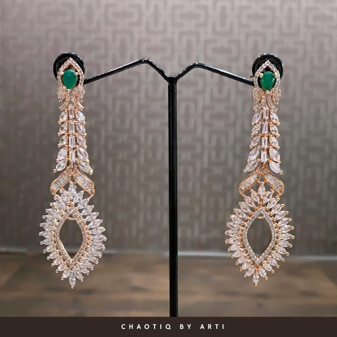 Emerald studded long diamond earrings