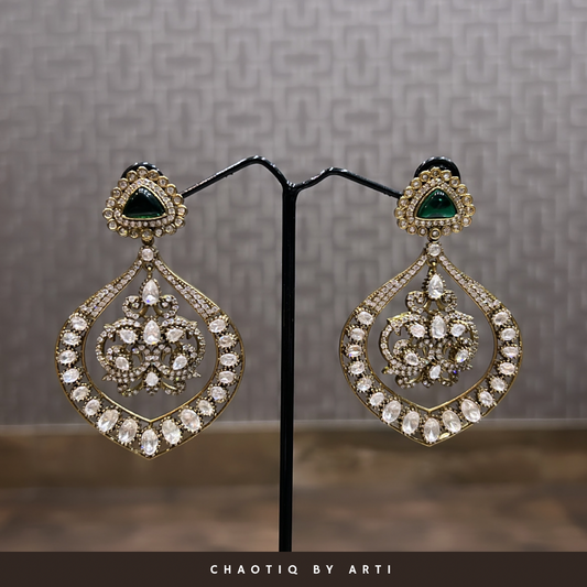 Antique polished paan shaped polki and emerald earrings