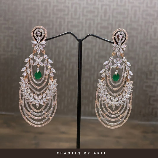 Diamond and emerald studded statement earrings